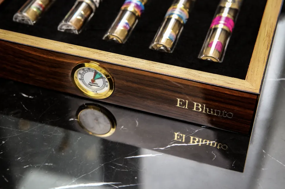 Glass tubes of El Blunto lined up in a humidor